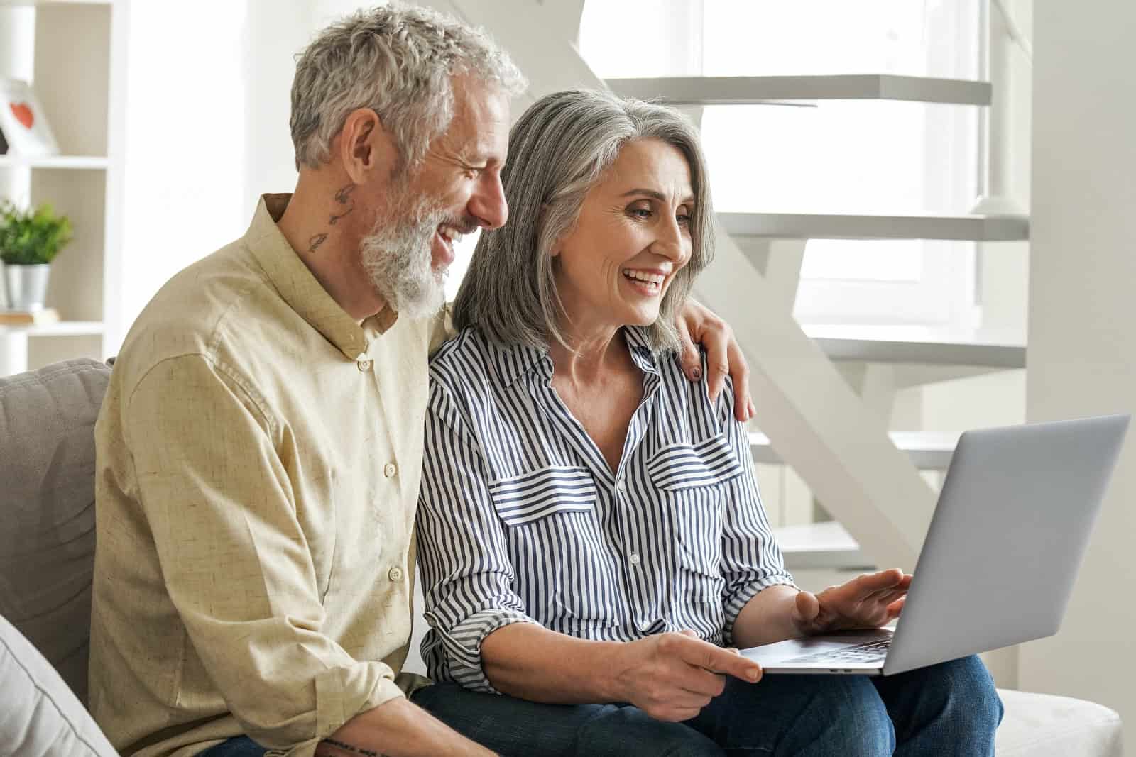Medical Power Of Attorney Elderly Couple Looking At Laptop Computer Together.