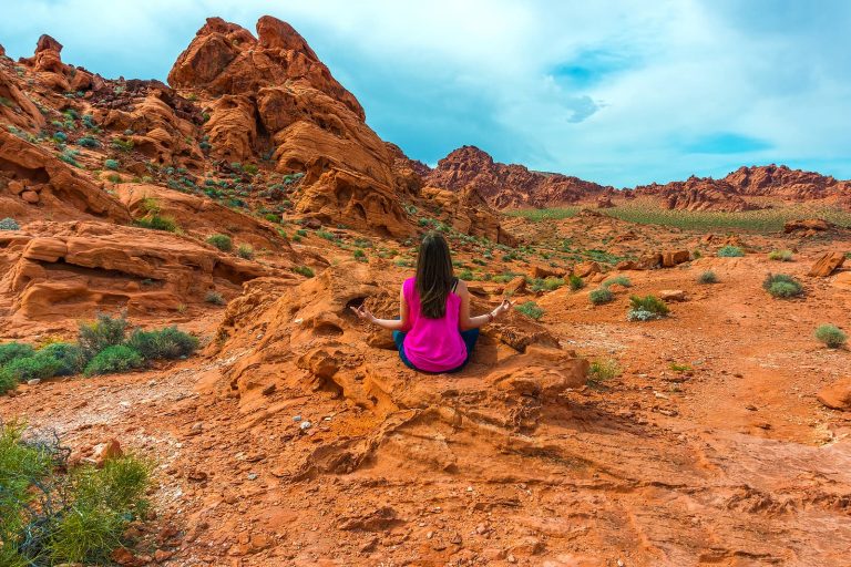 A Nevada Woman Meditating In The Valley Of Fire