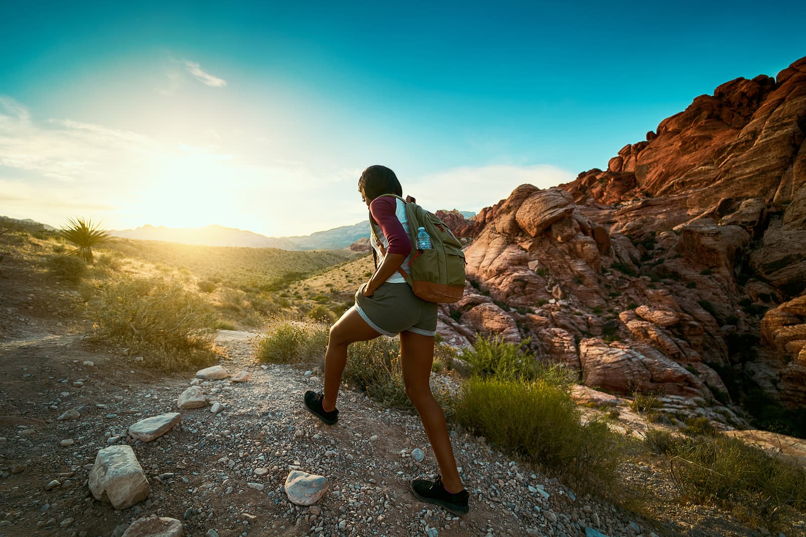 A woman goes hiking in the Nevada desert